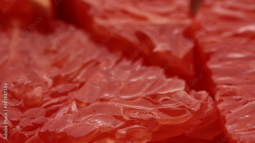 sliced fresh red grapefruit closeup, macro shot