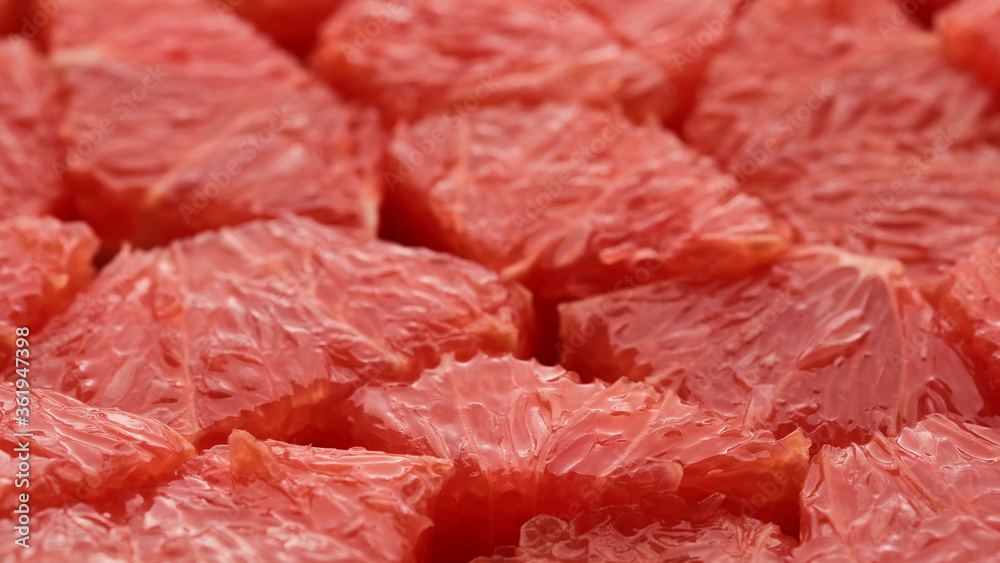 rotating sliced fresh red grapefruit rotating sliced fresh red grapefruit