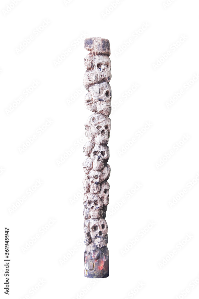 Skull Head wood pole with carving patterns isolated on white background and clipping path
