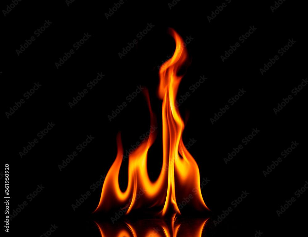 Fire with reflection on a dark background.