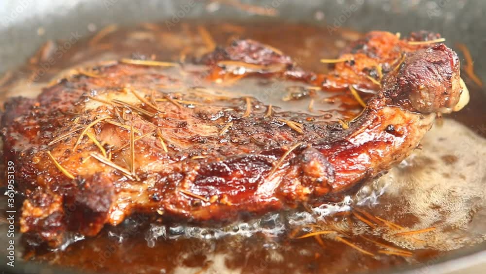 Frying sirloin steak in pan with butter, in door  Chiangmai  Thailand