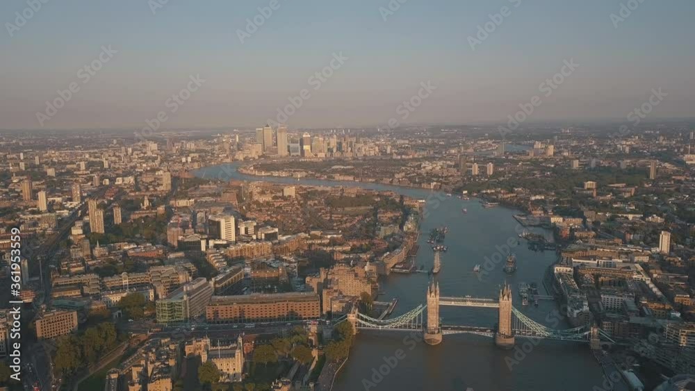 AERIAL: Flying backwards over Thames with Tower Bridge view at Sunset, Sunrise AERIAL: Flying backwards over Thames with Tower Bridge view at Sunset, Sunrise