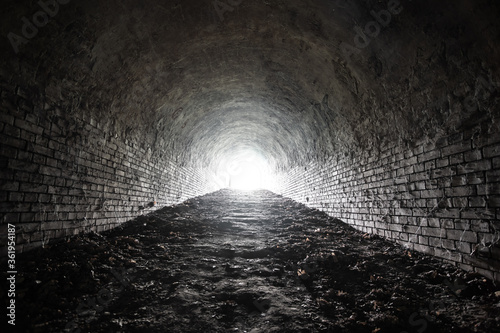 Ancient underground brick tunnel of the fortress. Interior of fort potern of 19th century.