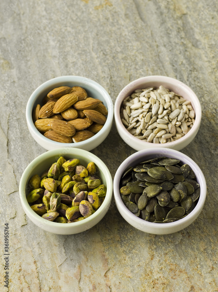 Nut and seed selection in four bowls Nut and seed selection in four bowls