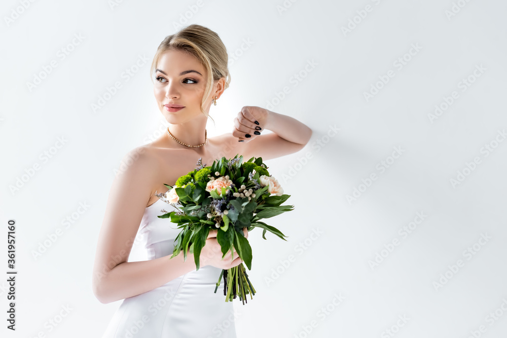 beautiful bride in elegant wedding dress holding flowers on white beautiful bride in elegant wedding dress holding flowers on white