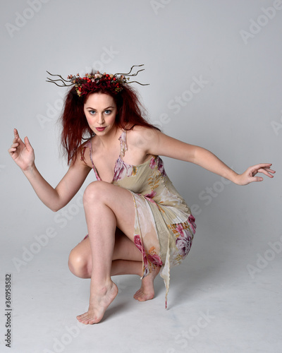 Canvas Print full length pose of red hair girl wearing floral fairy dress and headdress