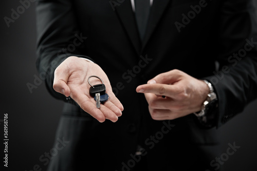 Finger pointing towards car keys
