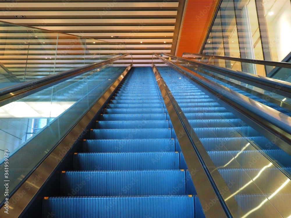 escalator in modern office building escalator in modern office building