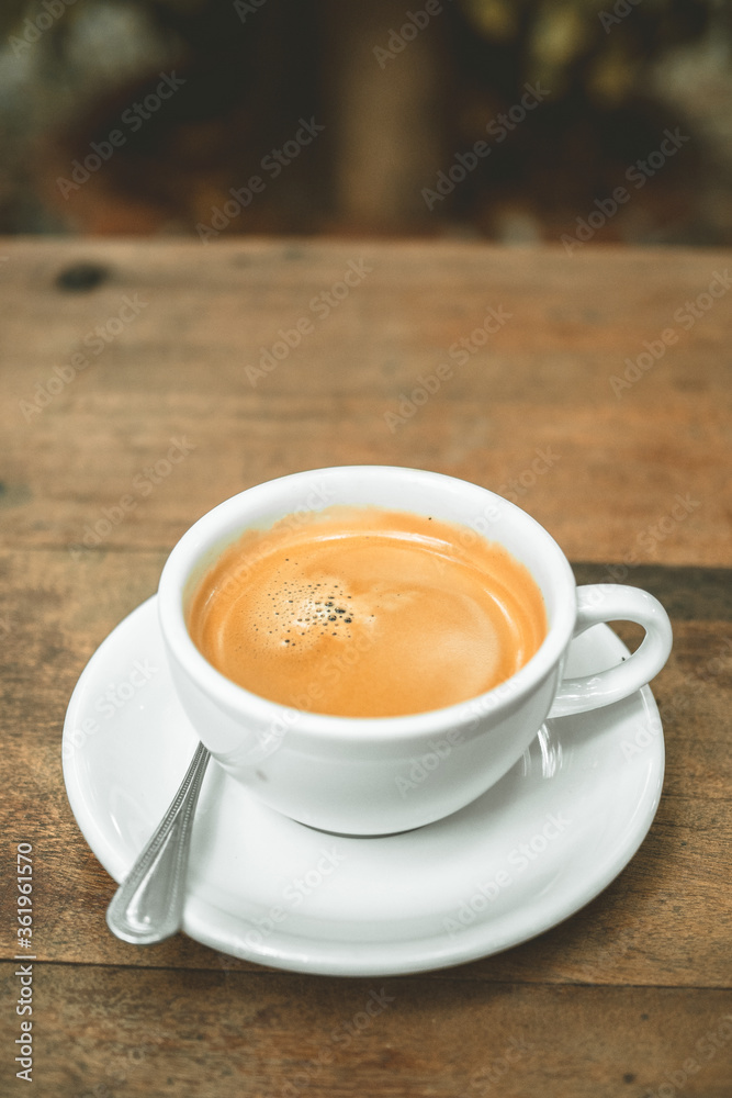 black coffee on wood table.vertical image black coffee on wood table.vertical image