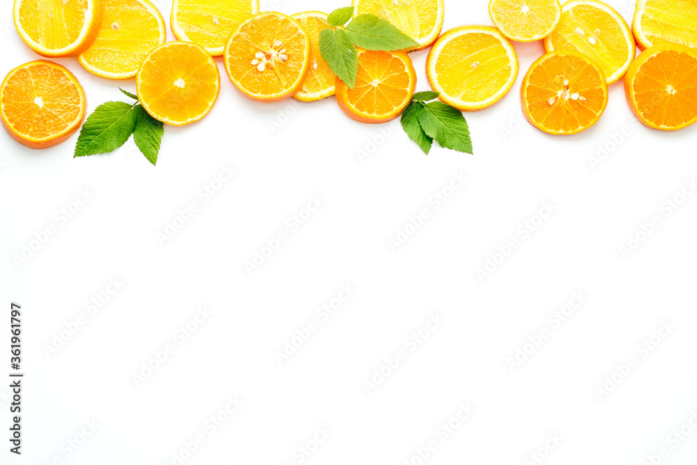 Naklejka Sliced citrus on white background top view