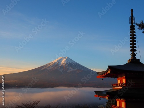 Pagoda called Chureito-tower and Mt. Fuji with sea of clouds in autumn sunrise