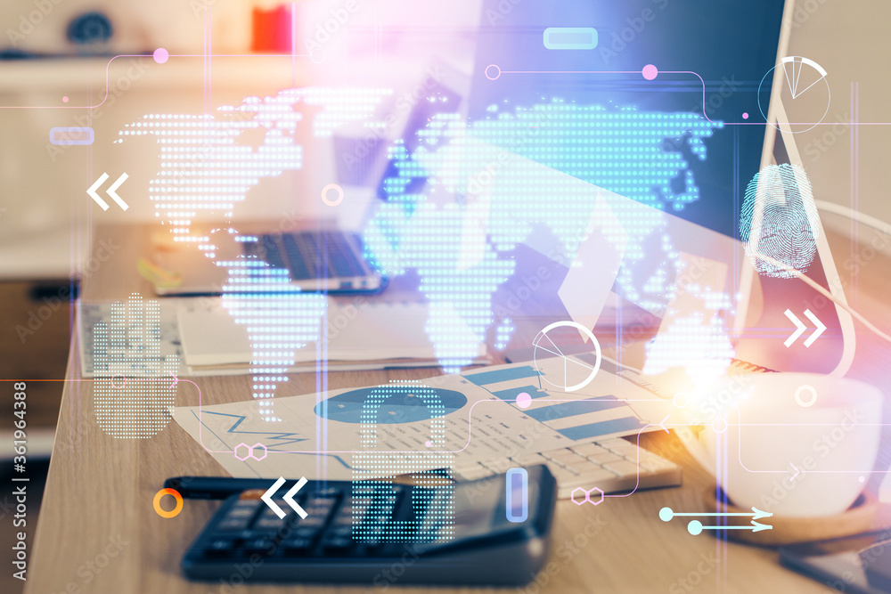 Multi exposure of table with computer and world map hologram. International data network concept. Multi exposure of table with computer and world map hologram. International data network concept.