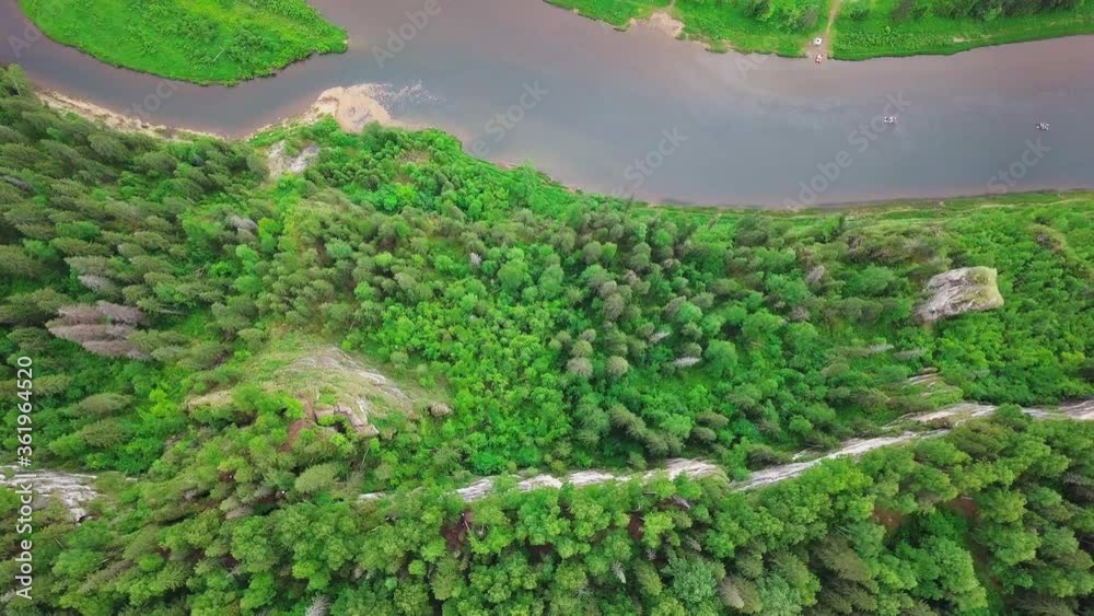 Twin-hull Boats Floating Down Calm River Surrounded with Evergreen Pine Tree. Top Aerial View Twin-hull Boats Floating Down Calm River Surrounded with Evergreen Pine Tree. Top Aerial View