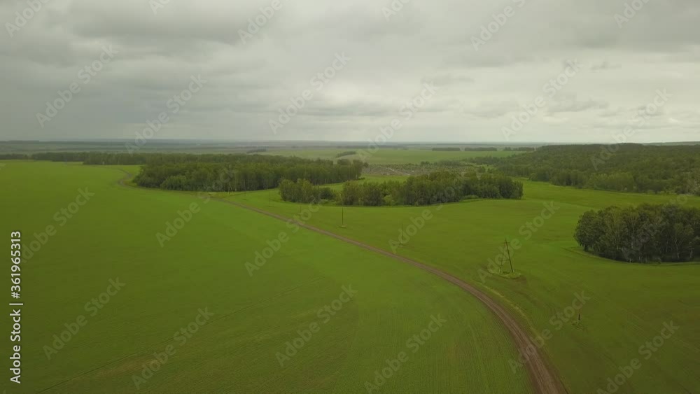 a flying camera takes a green field in Siberia a flying camera takes a green field in Siberia