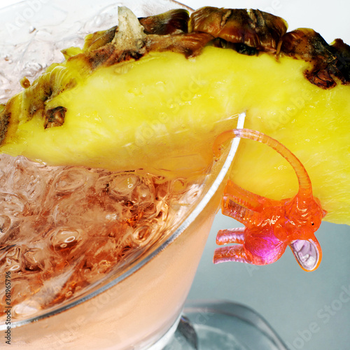 Cocktail with pineapple and pink elephant photo