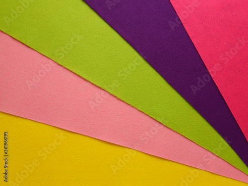 Fan of colored bright felt textile material.