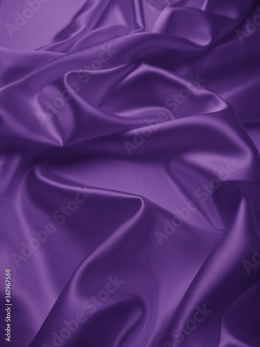Beautiful smooth elegant wavy violet purple satin silk luxury cloth fabric texture with violet background design. Card or banner. Copy space