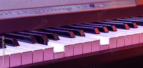 Piano keys on a beautiful colored background.