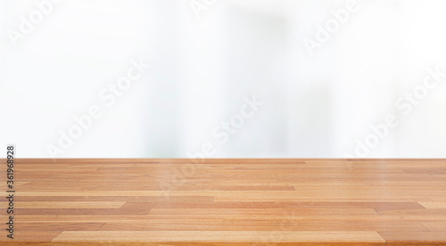 A beautiful empty wood board with white blur glass window wall building background .For montage product display or design key visual layout background..