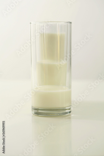 Obraz na plátne Three glasses of milk with different amount