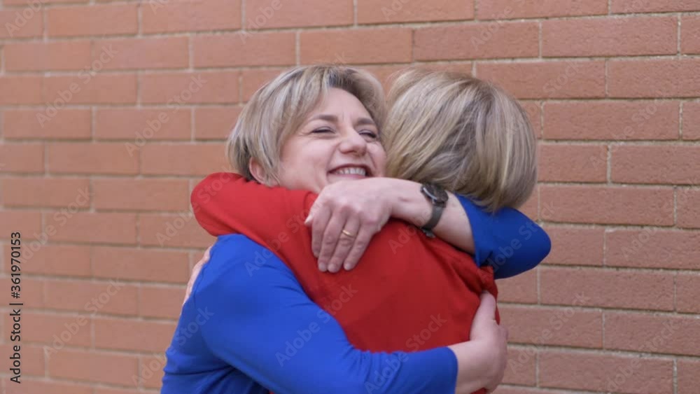 happiness, joy - two sisters celebrate the end of the pandemic by embracing happiness, joy - two sisters celebrate the end of the pandemic by embracing