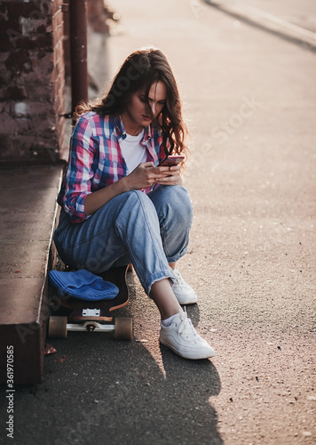 stylish beautiful young woman model with smartphone