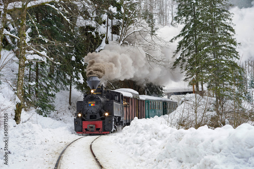 Winter scenery in Maramures Mountains, Romania steam train