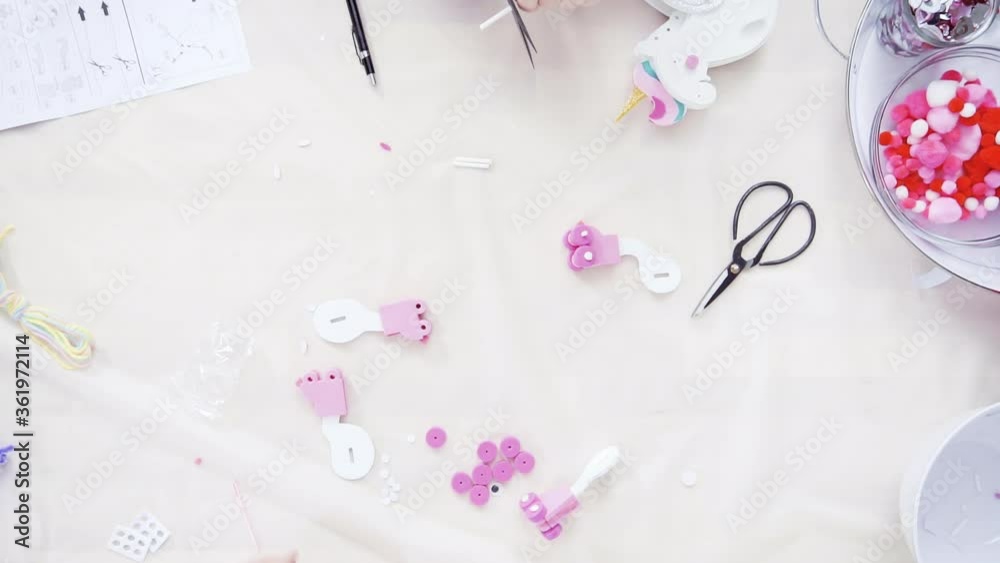 Flat lay. Step by step. Mother and daughter making unicorn craft from paper foam. Flat lay. Step by step. Mother and daughter making unicorn craft from paper foam.