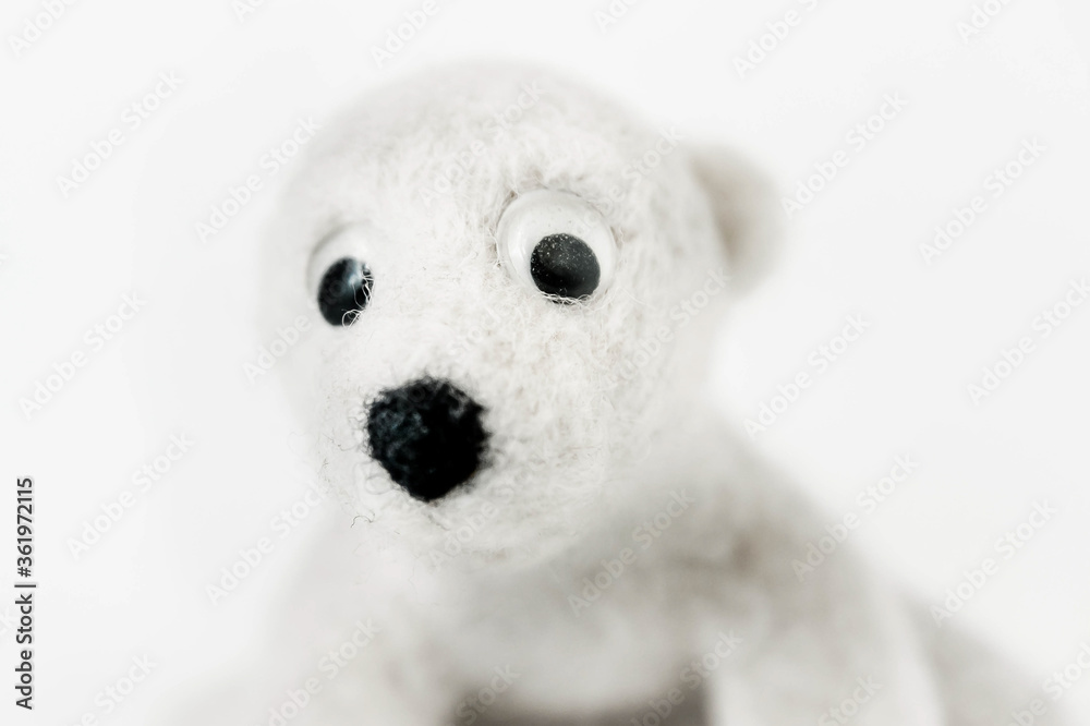 toy polar bear made of felted wool close up on white background toy polar bear made of felted wool close up on white background