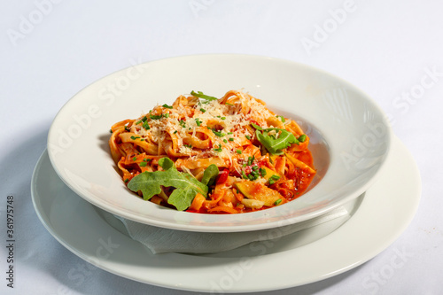 Tagliatelle with tomato sauce and parmesan cheese