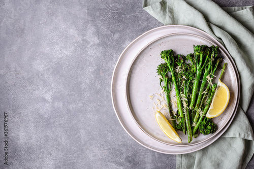 Roasted broccolini on the plate. photo