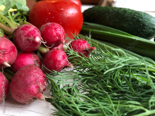 Closeup fresh and juicy vegetables are placed in a white wooden background.Selective focus