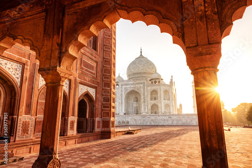 The magnificent Taj Mahal in India shows its full splendor at a glorious sunrise. photo