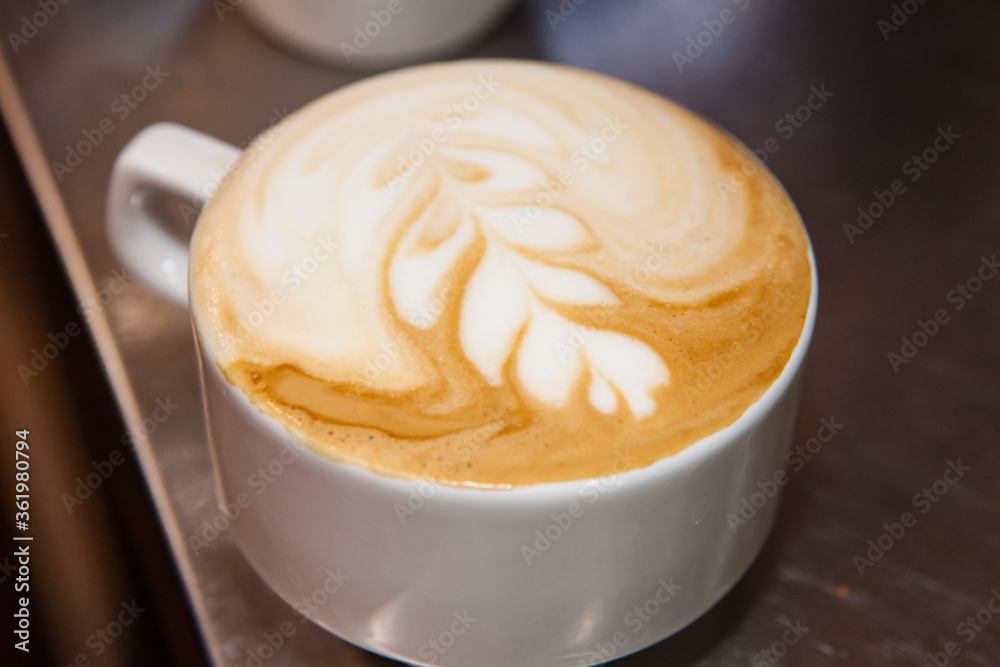 cup of cappuccino with cream cup of cappuccino with cream
