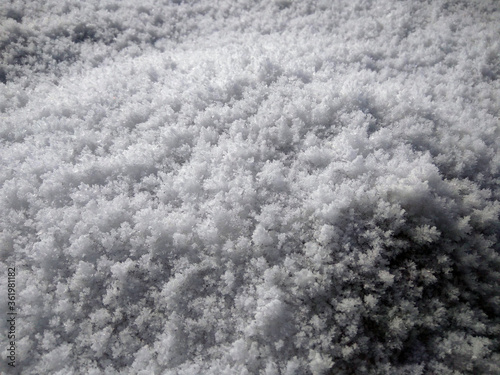 White icy snow on the stones of the mountain. Sinai. Romania.