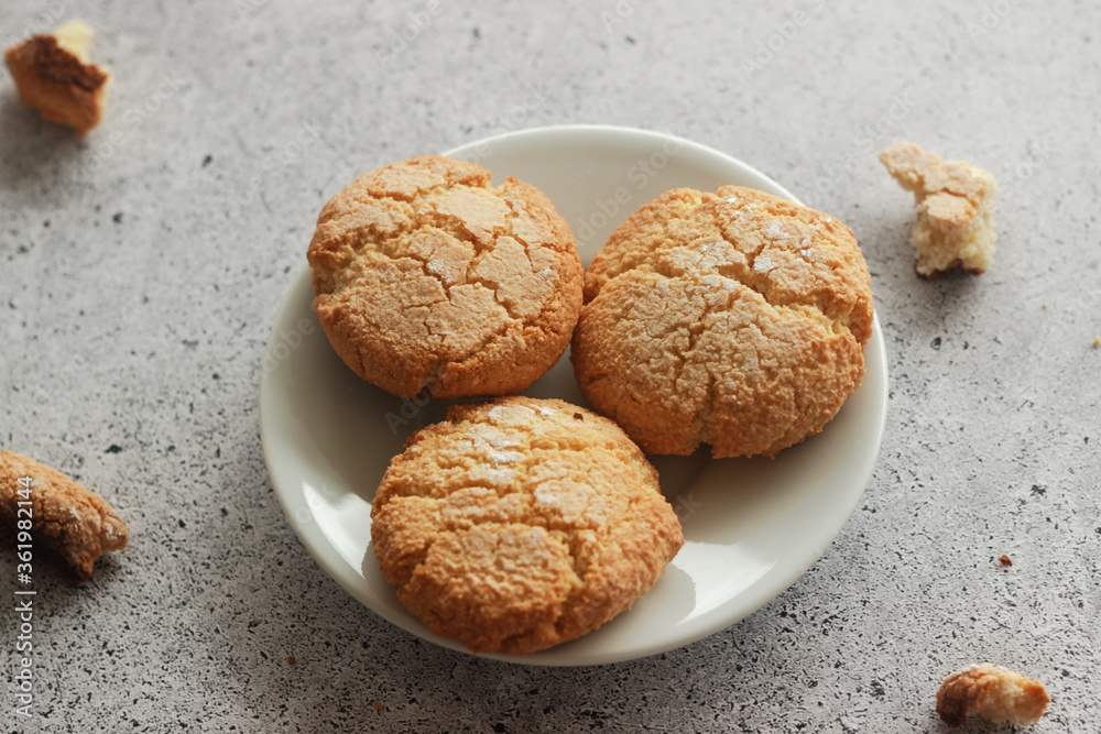 Tasty almond cookies with milk. Cookies on a plate Tasty almond cookies with milk. Cookies on a plate