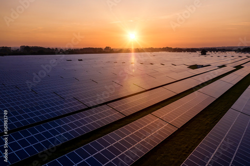 Sunrise over a modern solar farm