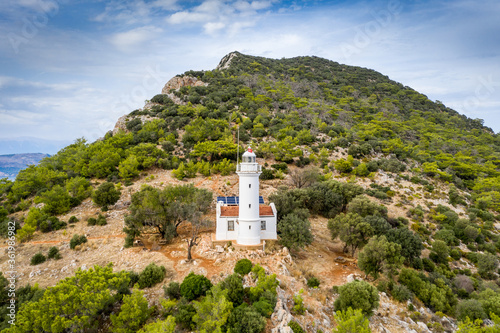 Fototapeta Naklejka Na Ścianę i Meble -  Gelidonya Lighthouse at  cape in Mediterranean sea. Lighthouse and three Islands on Lycian Way in. Karaoz, Antalya, TURKEY