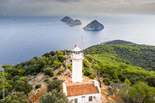 Gelidonya Lighthouse at  cape in Mediterranean sea. Lighthouse and three Islands on Lycian Way in. Karaoz, Antalya, TURKEY