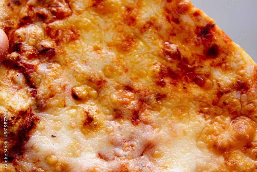 slice of cheese pizza closeup. slice of cheese pizza closeup.