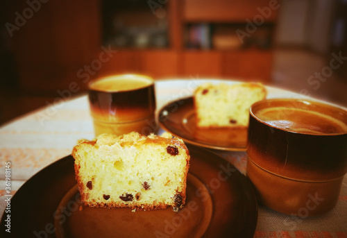 Yeast cake with crumble and raisins. And a cup of tasty coffee. photo