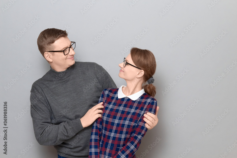 Portrait of happy man and woman looking at each other and smiling Portrait of happy man and woman looking at each other and smiling