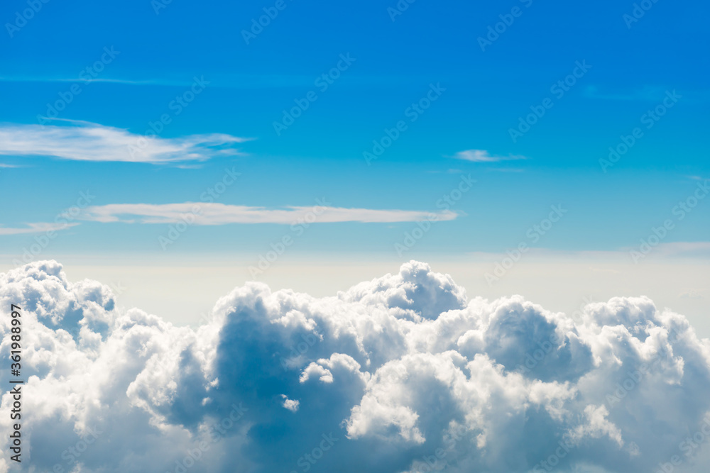 White clouds on blue sky with above aerial view from a plane, nature blue sky background White clouds on blue sky with above aerial view from a plane, nature blue sky background