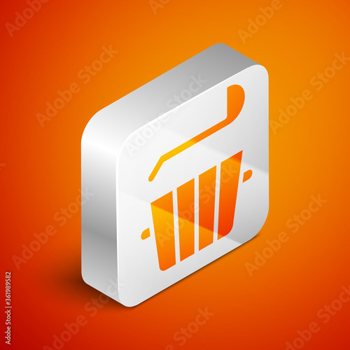 Isometric Sauna bucket and ladle icon isolated on orange background. Silver square button. Vector.