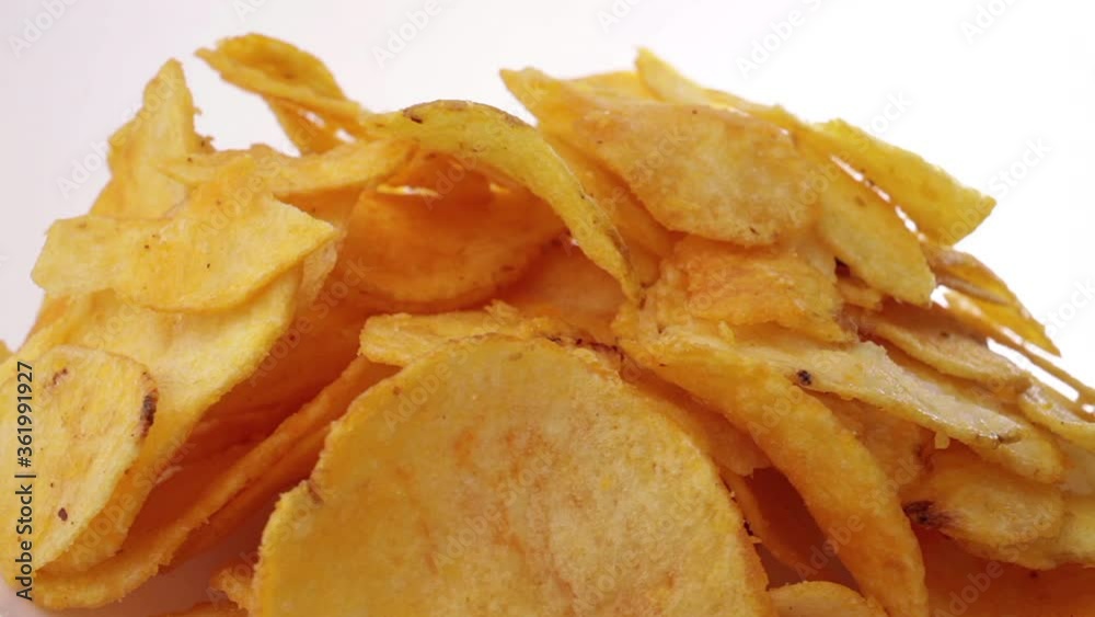 Potato chips - the rotation. Close up shooting. Potato chips - the rotation. Close up shooting.