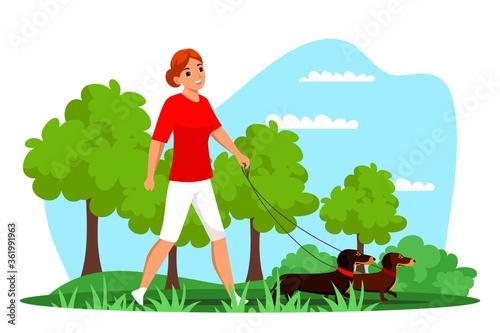 Pet owner walking dog on leash outdoor in park