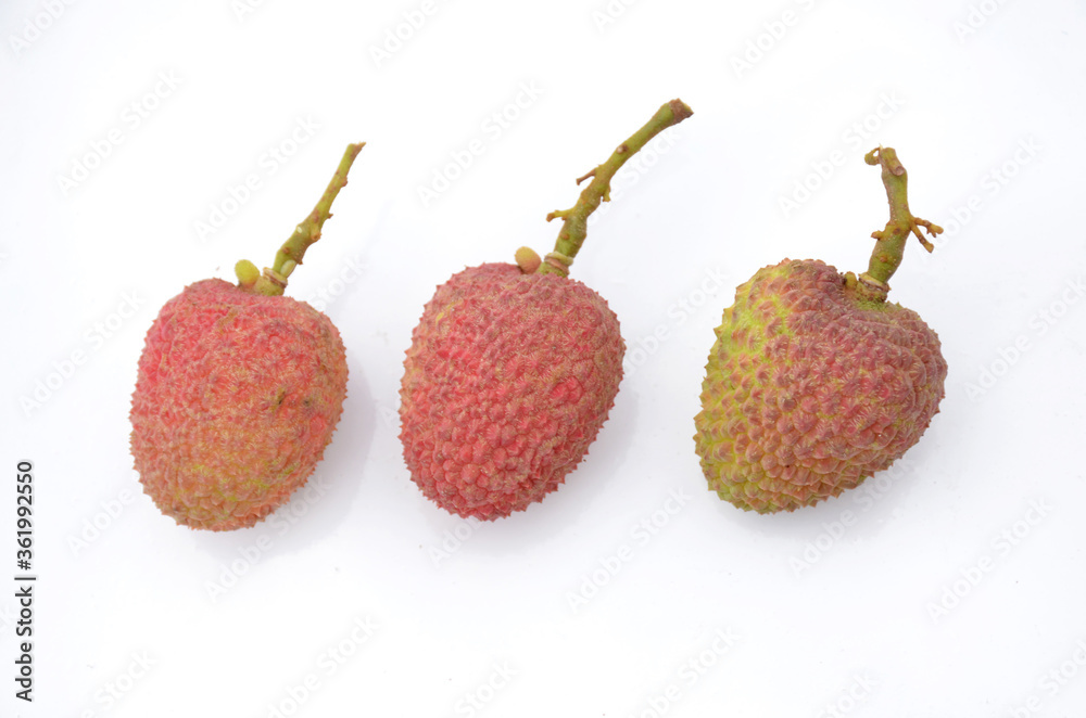 the three red ripe lychee isolated on white background. the three red ripe lychee isolated on white background.