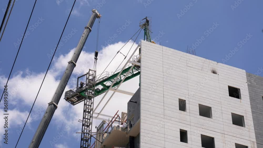 Dismantling a crane on the construction site