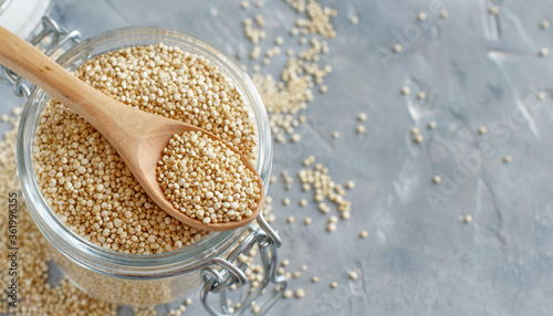 Raw dry white quinoa seeds close up photo