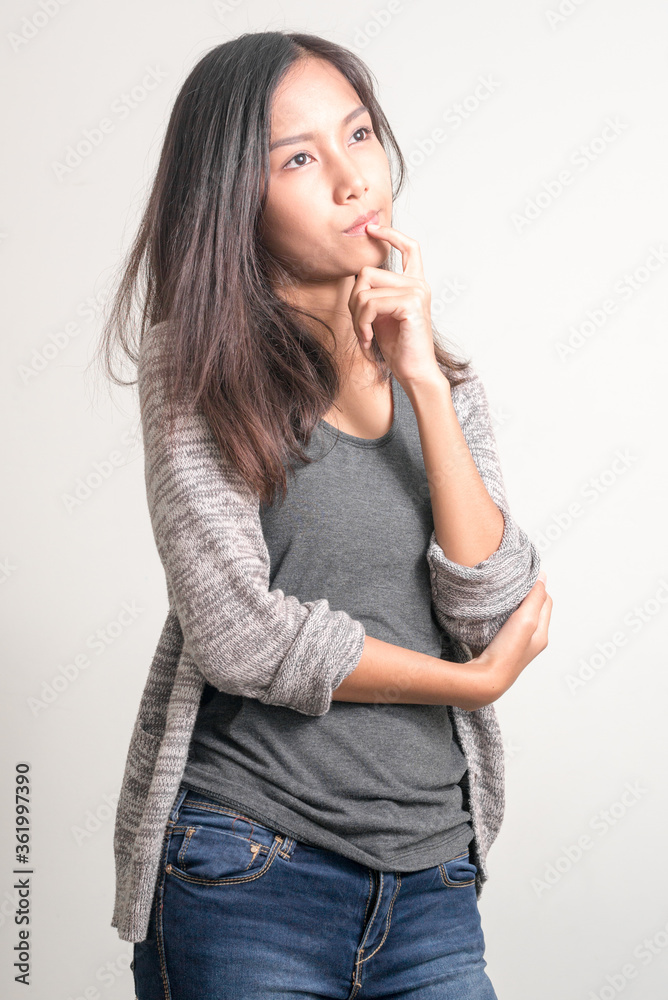 Portrait of young beautiful Asian teenage girl thinking Portrait of young beautiful Asian teenage girl thinking